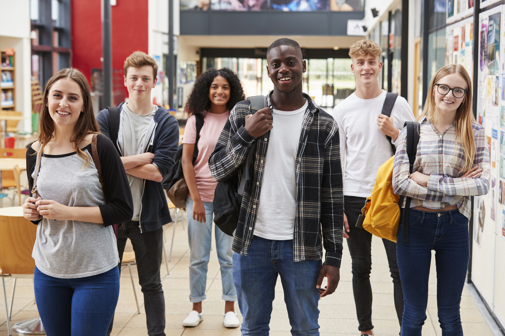 Portrait Of Student Group In Communal Area Of Busy College